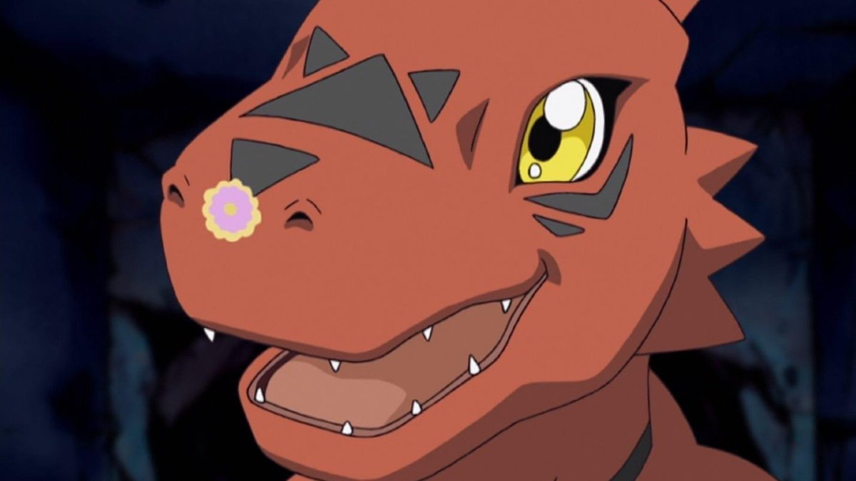 Guilmon with a flower on their nose.